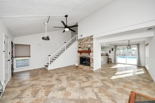 a view of an empty room with a fireplace
