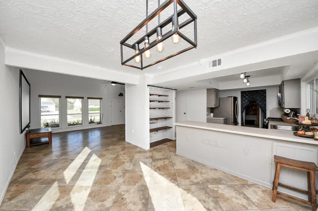 a large living room with a large window