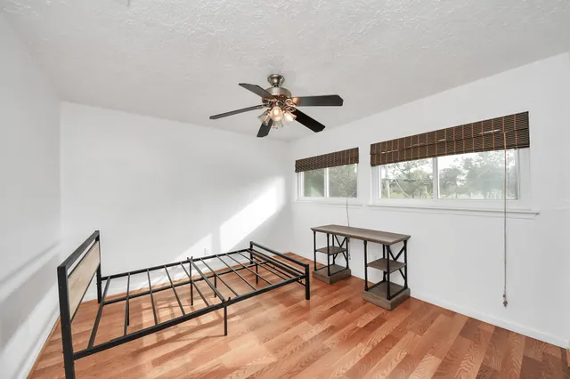 a view of workspace with wooden floor
