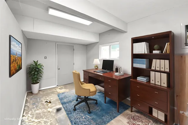 a view of a workspace with furniture