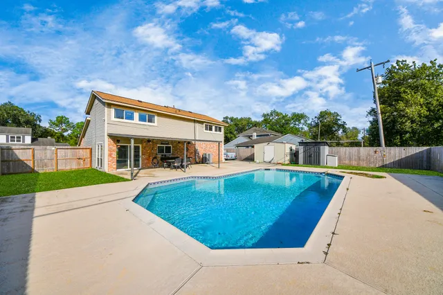 a view of a house with swimming pool