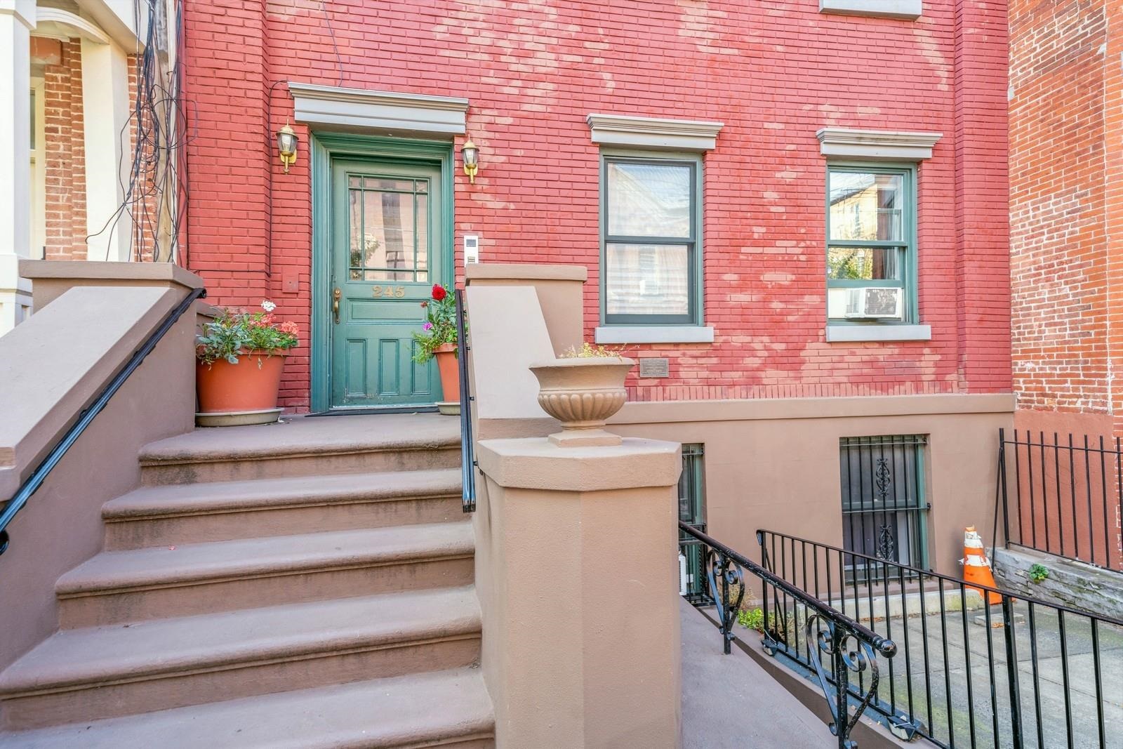 245 3rd Street, Unit 2 Jersey City, NJ 07302 - Photo 19 of 19 a view of a brick house with a large window