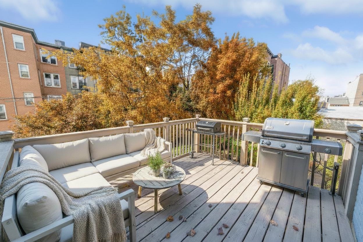 245 3rd Street, Unit 2 Jersey City, NJ 07302 - Photo 8 of 19 a view of balcony with furniture and wooden floor