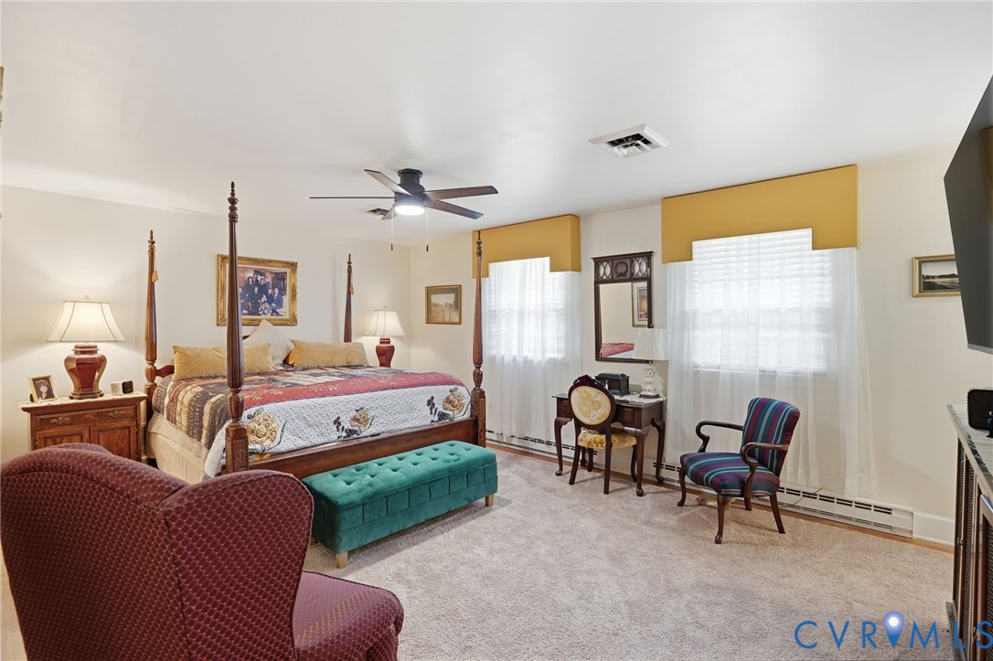 11016 Pridesville Road Amelia Court House, VA 23002 - Photo 37 of 54 Carpeted bedroom featuring a ceiling fan with inte