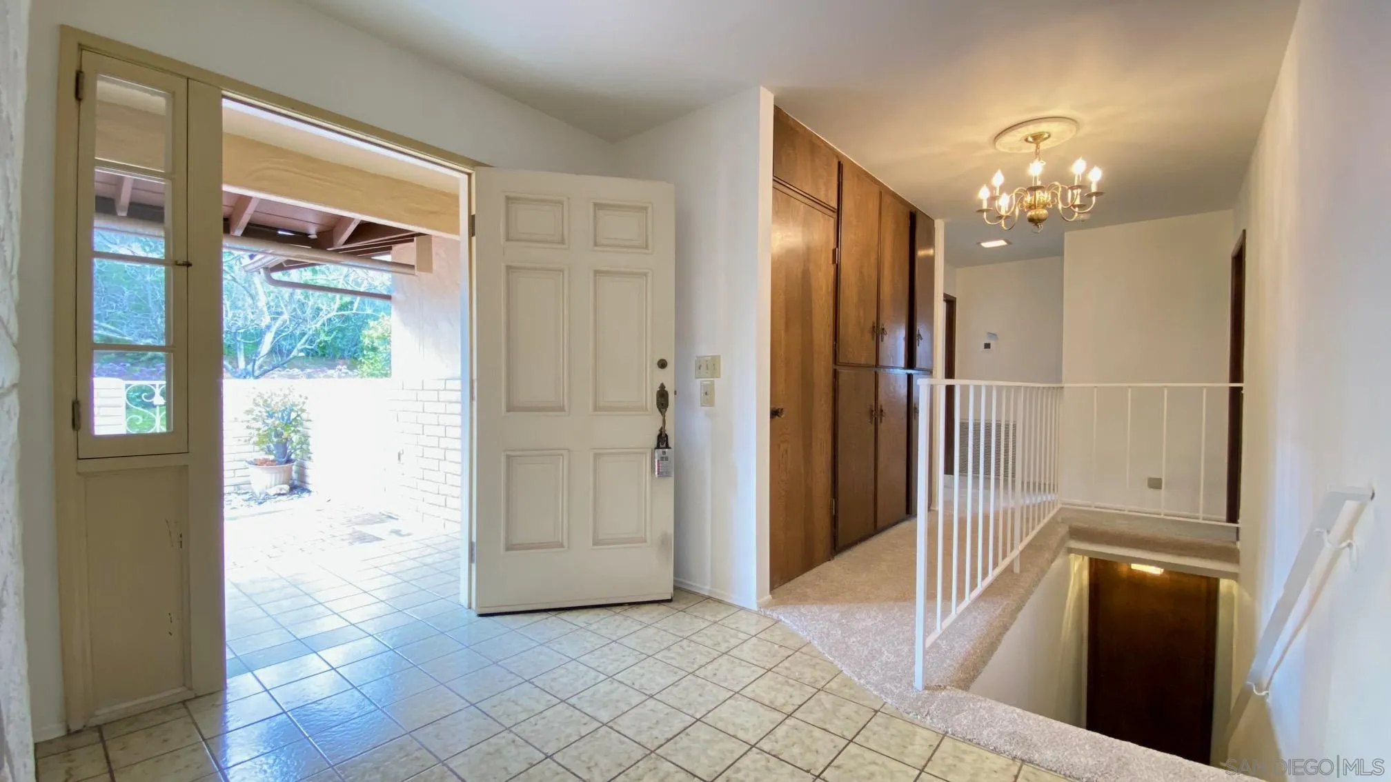 4351 Crestview Drive La Mesa, CA 91941 - Photo 19 of 49 a view of a hallway with wooden floor and a living room