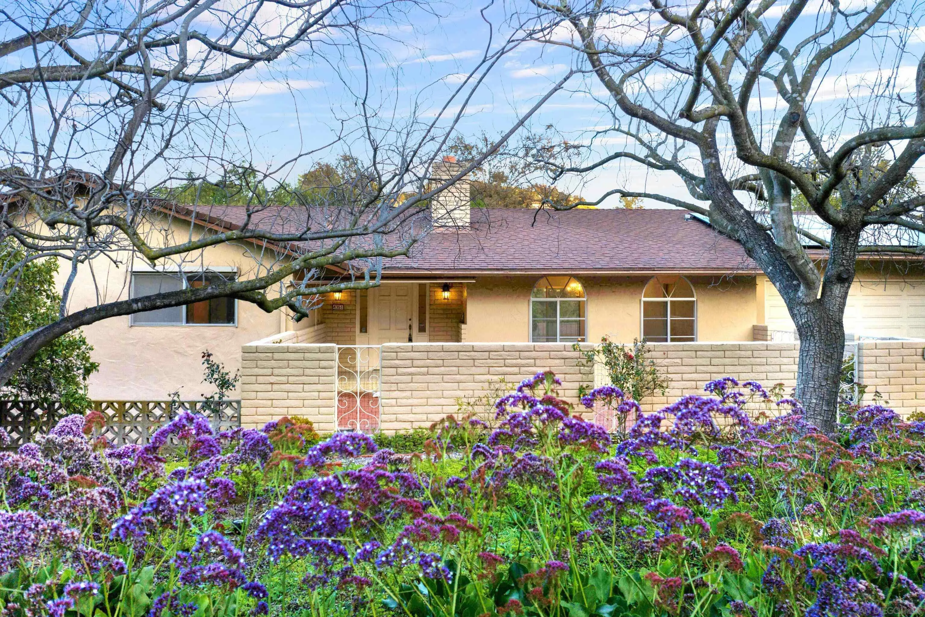 4351 Crestview Drive La Mesa, CA 91941 - Photo 3 of 49 a front view of a house with yard and fountain