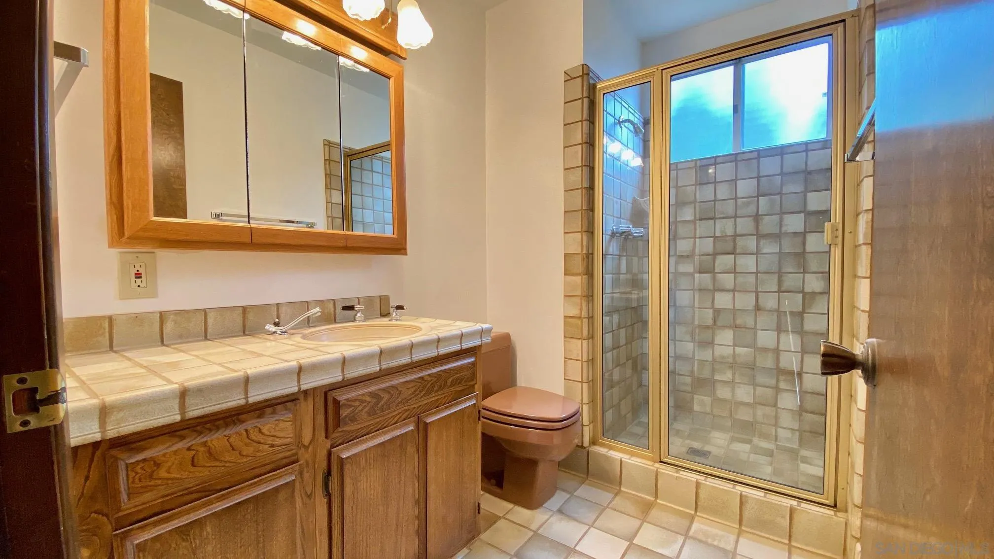 4351 Crestview Drive La Mesa, CA 91941 - Photo 33 of 49 a bathroom with a sink a toilet and shower
