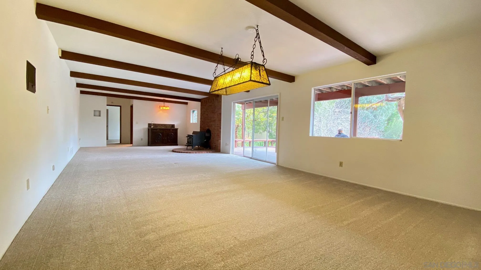 4351 Crestview Drive La Mesa, CA 91941 - Photo 35 of 49 a view of an empty room with a fireplace and a window
