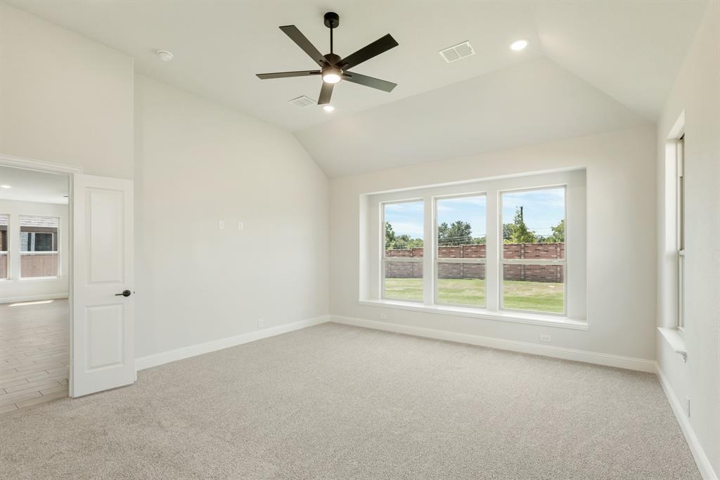 717 Seahawk Street Joshua, TX 76058 - Photo 20 of 40 an empty room with a empty space and a ceiling fan