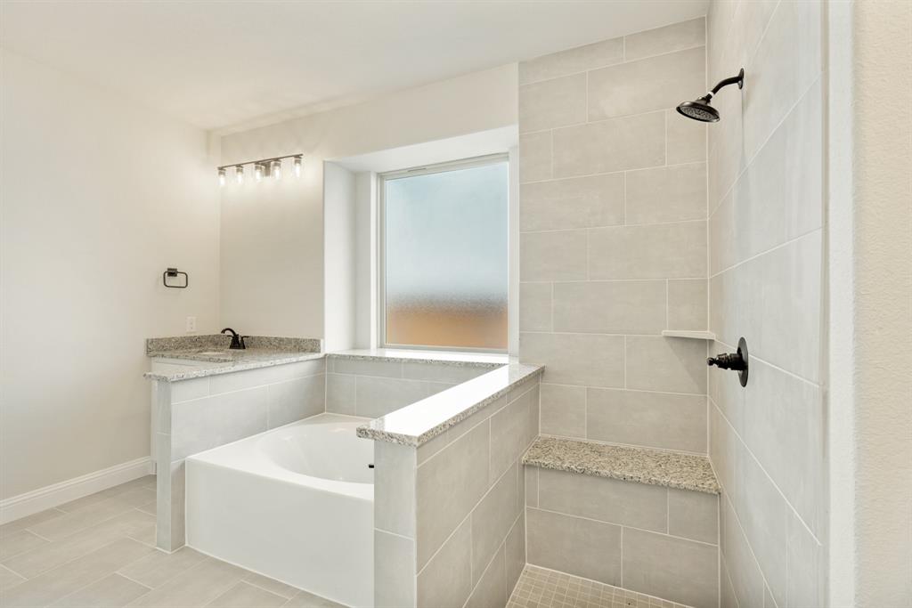 717 Seahawk Street Joshua, TX 76058 - Photo 23 of 40 a bathroom with a sink and shower