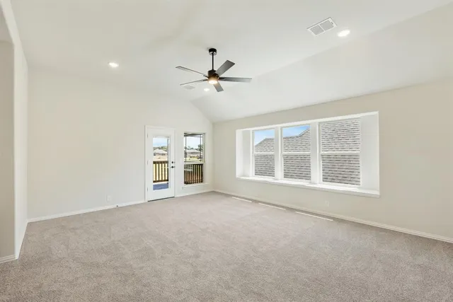 an empty room with a empty space and windows