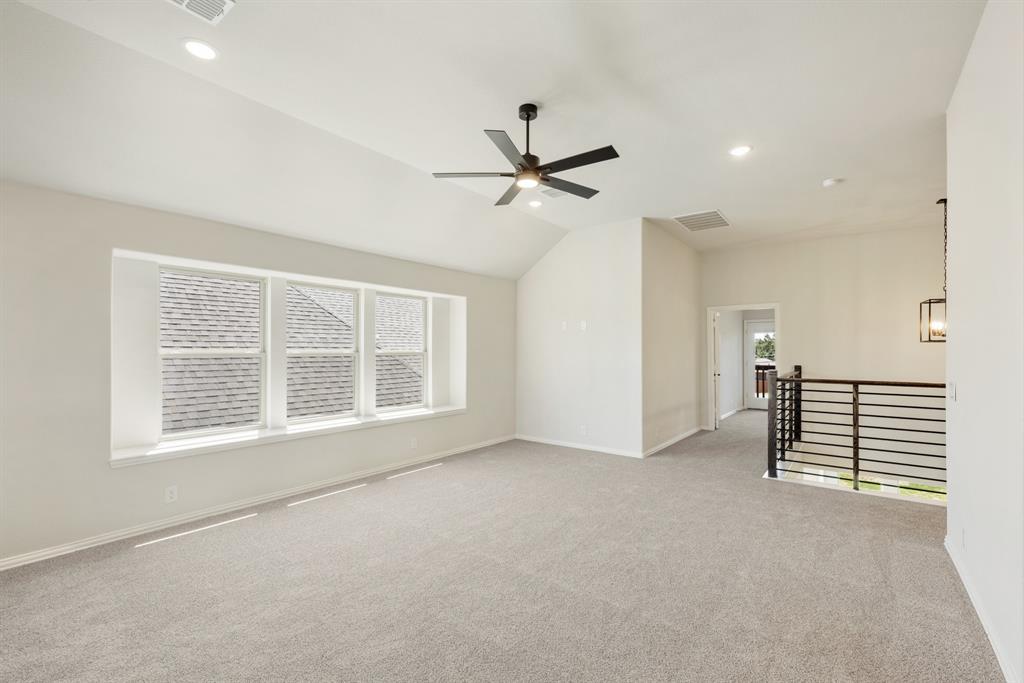 717 Seahawk Street Joshua, TX 76058 - Photo 27 of 40 an empty room with windows and fan