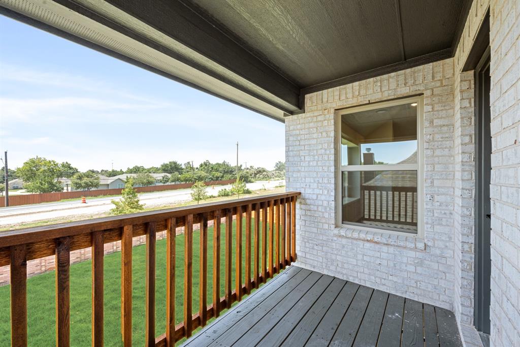 717 Seahawk Street Joshua, TX 76058 - Photo 31 of 40 a view of a balcony with wooden floor