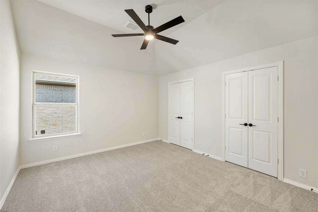 717 Seahawk Street Joshua, TX 76058 - Photo 34 of 40 an empty room with ceiling fan and windows