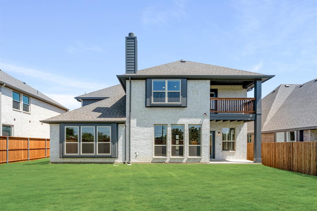 717 Seahawk Street Joshua, TX 76058 - Photo 37 of 40 a front view of a house with a yard