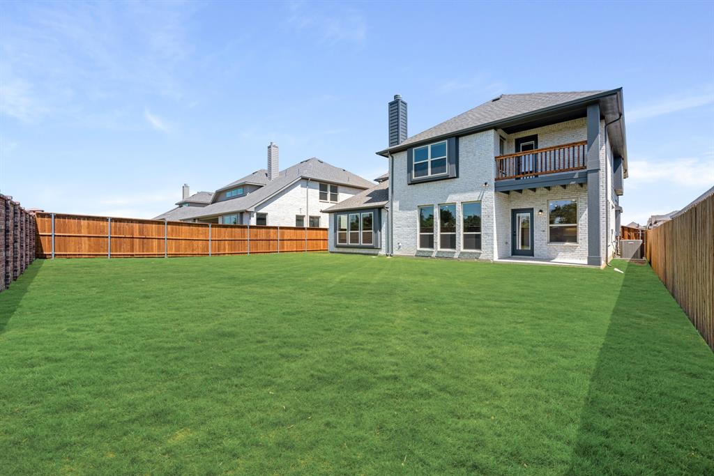 717 Seahawk Street Joshua, TX 76058 - Photo 39 of 40 a front view of a house with a yard