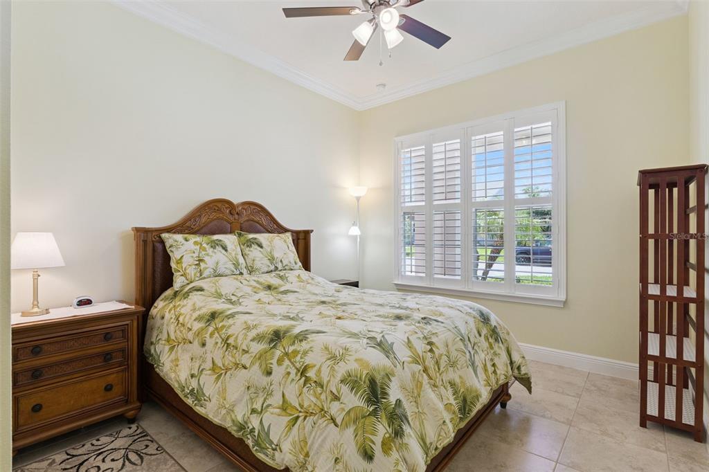 2665 Meadowedge Loop St. Cloud, FL 34772 - Photo 37 of 53 a large bed sitting in a bedroom next to a window