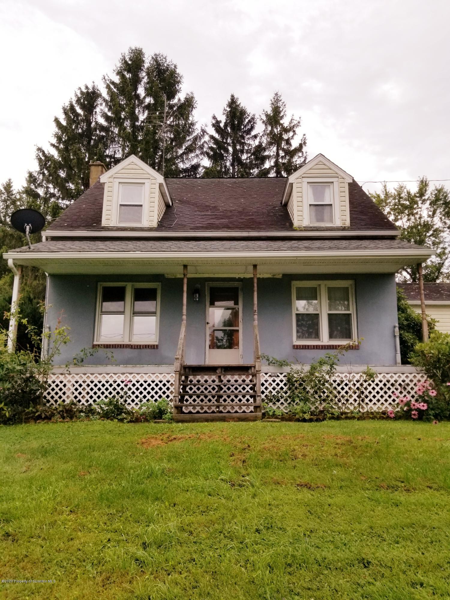 1265 Bendix Road Montrose, PA 18801 - Photo 1 of 20 a view of a white house with large windows