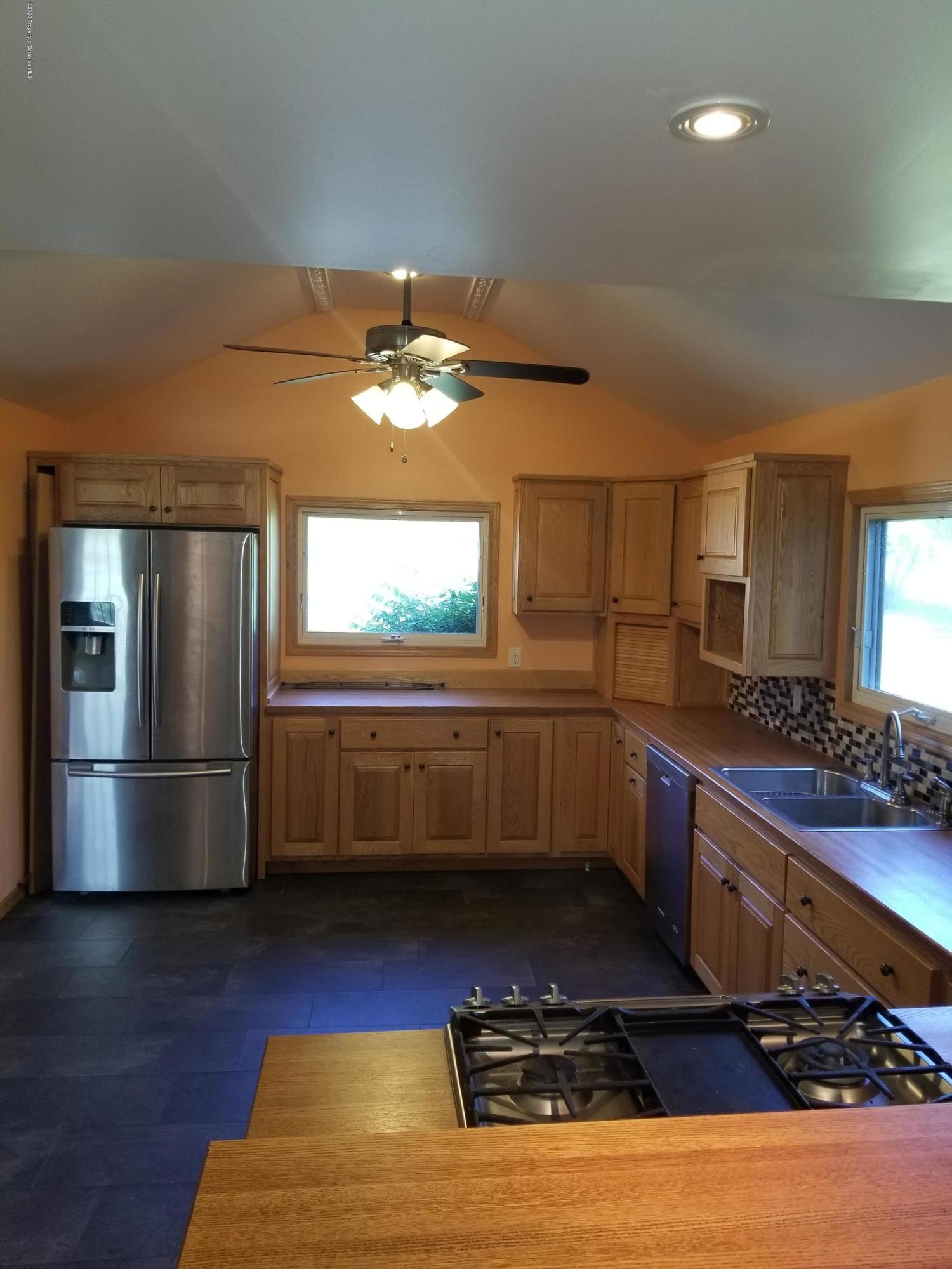 1265 Bendix Road Montrose, PA 18801 - Photo 5 of 20 a kitchen with stainless steel appliances granite countertop a refrigerator and a sink