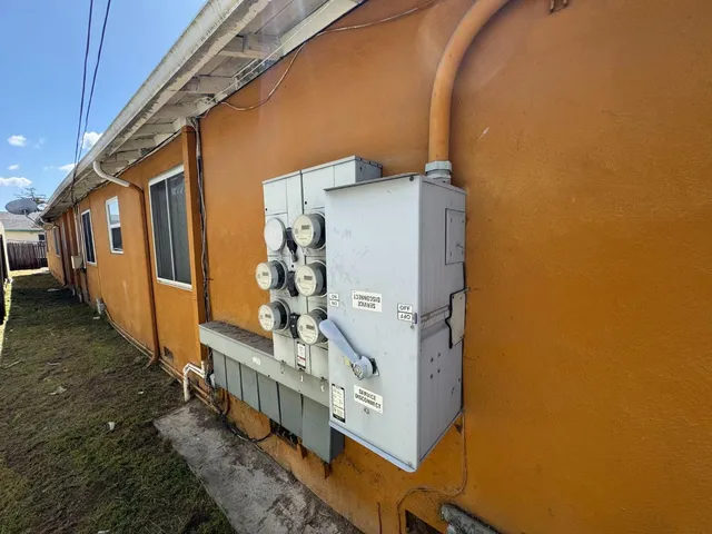 a view of a blue and white house in the background