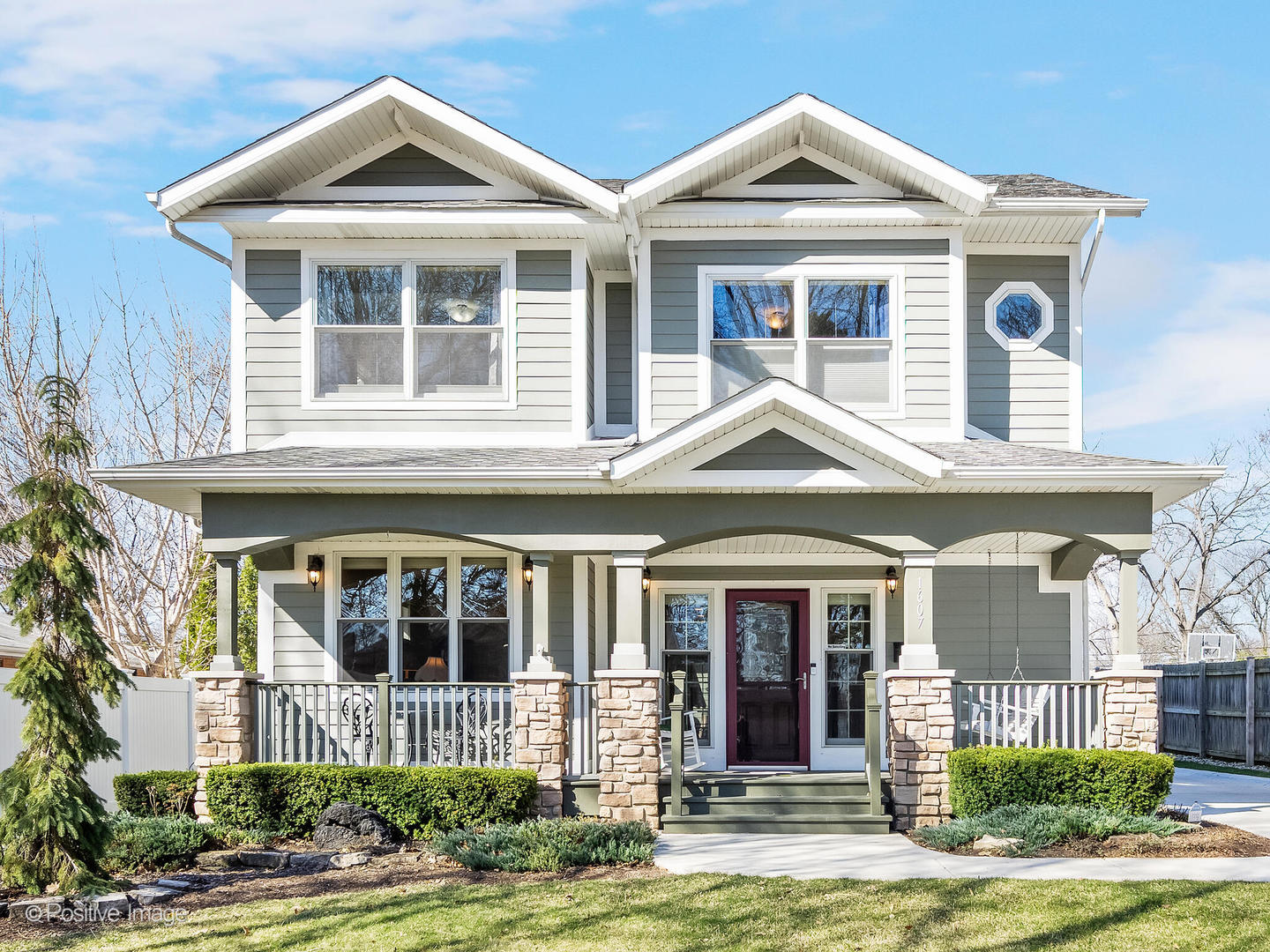 1607 East Indiana Street Wheaton, IL 60187 - Photo 1 of 31 a front view of a house with garden