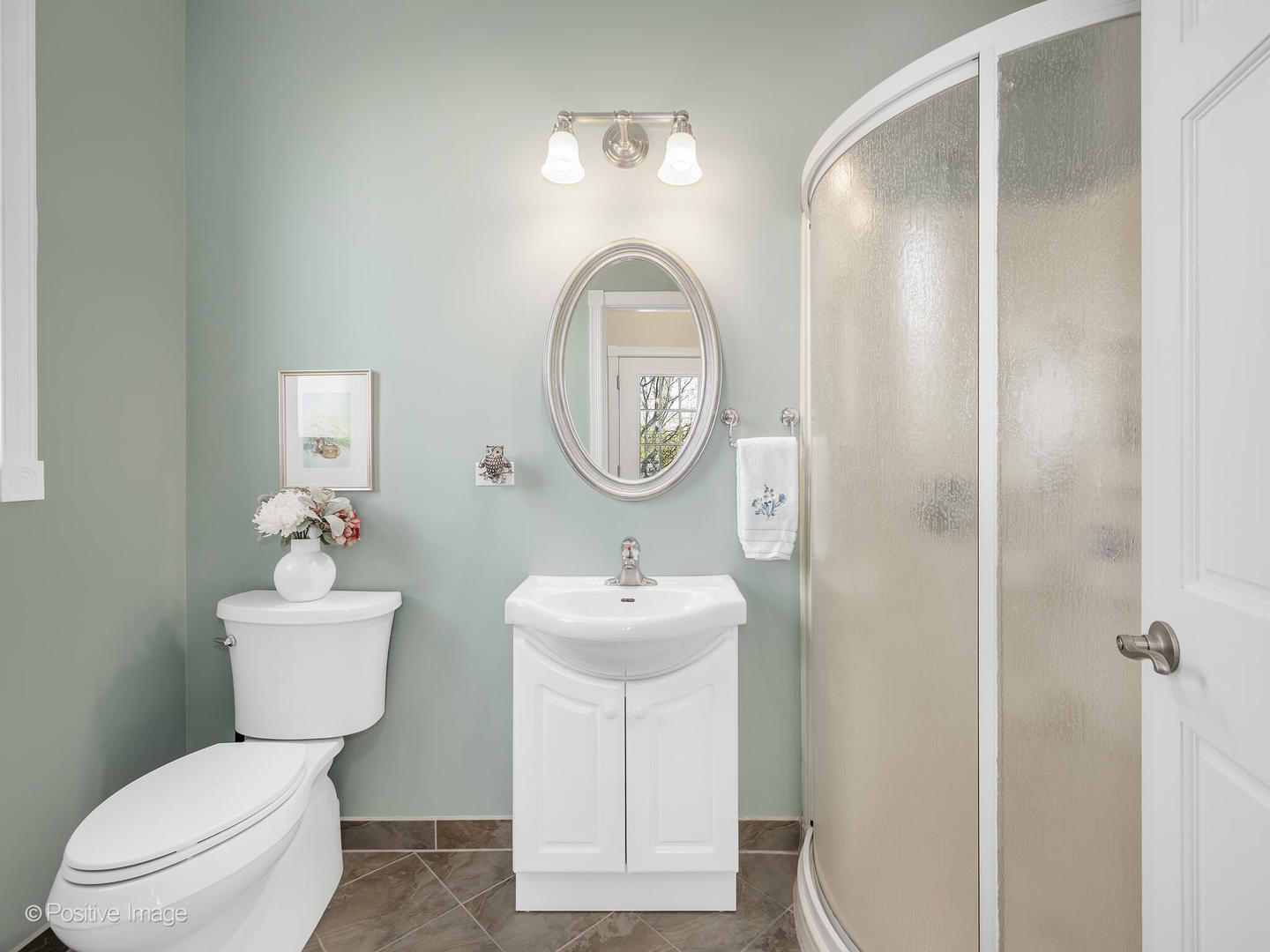 1607 East Indiana Street Wheaton, IL 60187 - Photo 16 of 31 a bathroom with a toilet a sink and a mirror