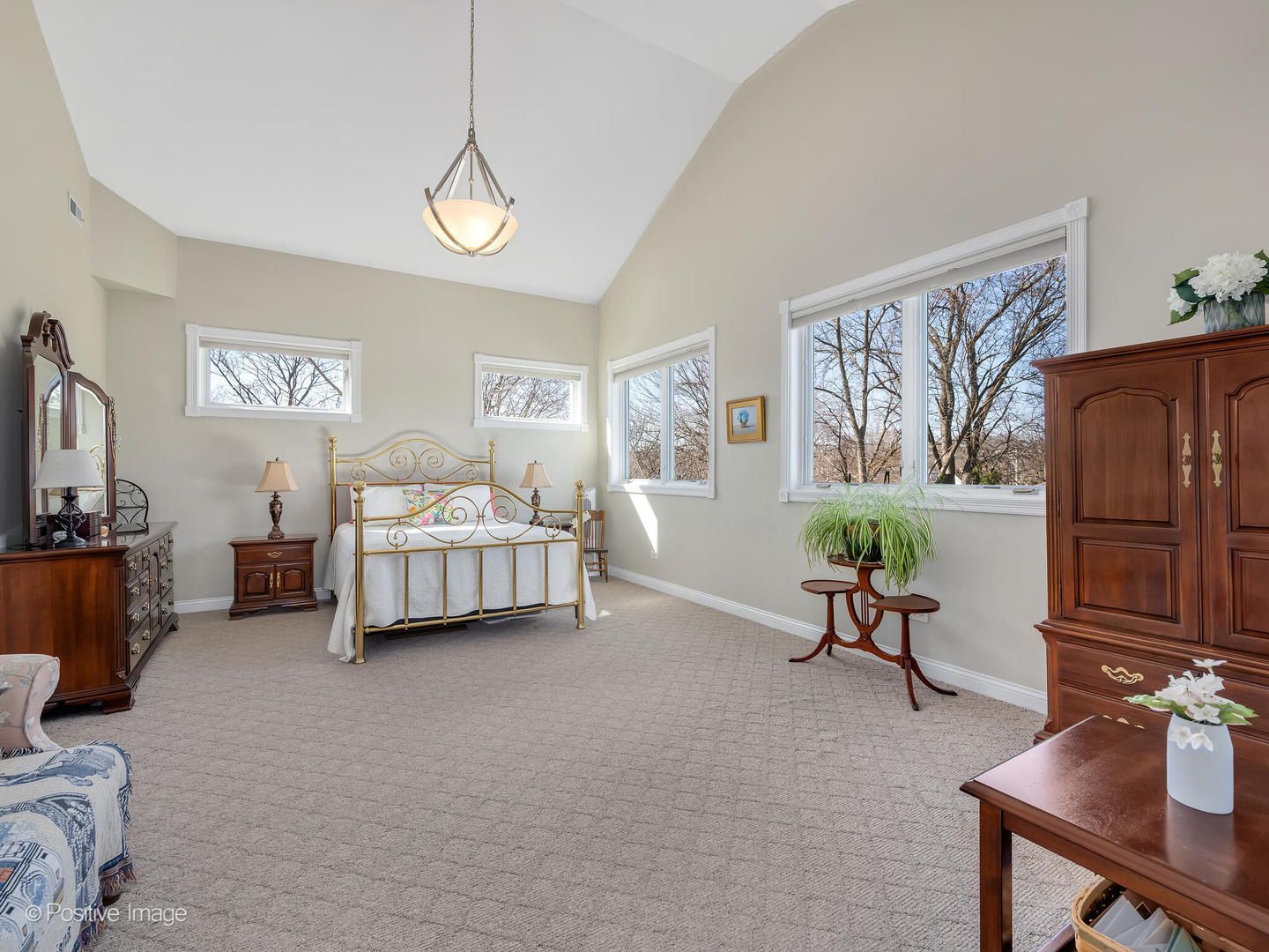 1607 East Indiana Street Wheaton, IL 60187 - Photo 18 of 31 a bedroom with furniture and a flat screen tv