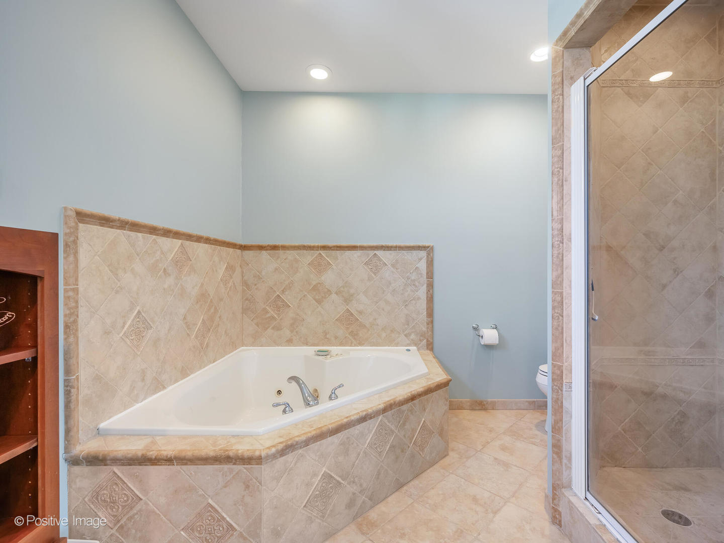 1607 East Indiana Street Wheaton, IL 60187 - Photo 19 of 31 a white bath tub sitting in a bathroom