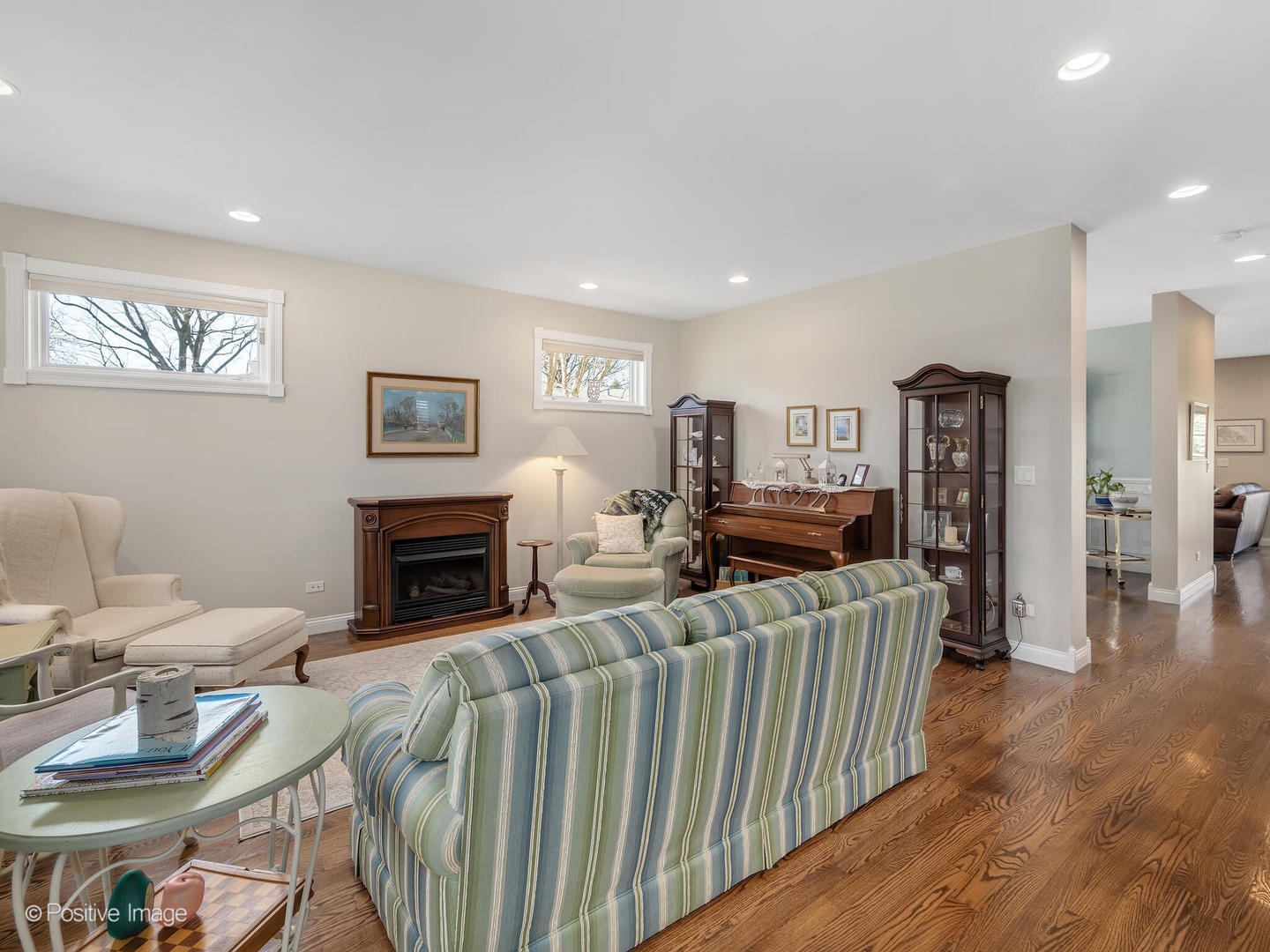 1607 East Indiana Street Wheaton, IL 60187 - Photo 6 of 31 a living room with furniture a fireplace and a flat screen tv