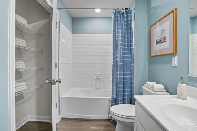 a white toilet sitting next to a bathroom sink