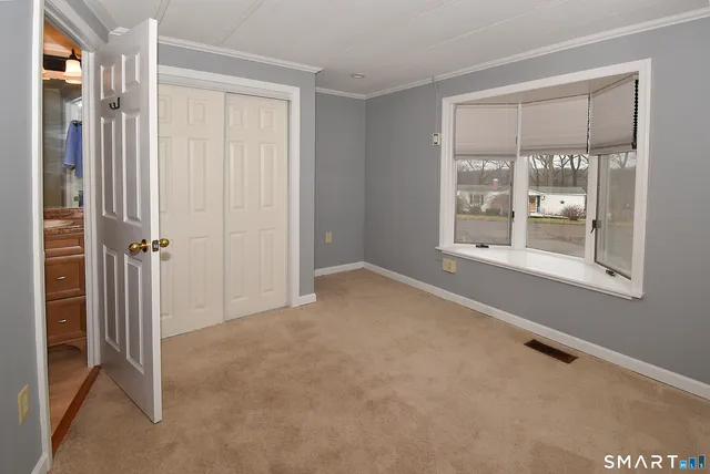 a view of an empty room with a window