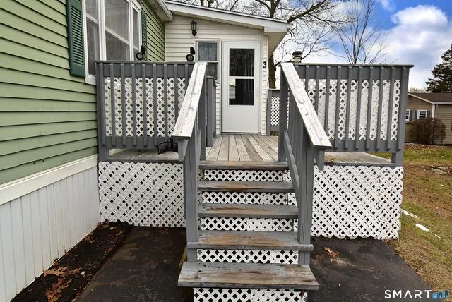 a view of a house with wooden fence