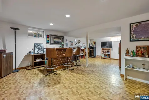 a view of a livingroom with furniture and a flat screen tv