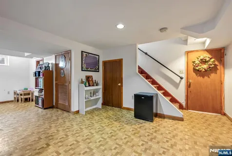 a view of a livingroom with furniture and staircase