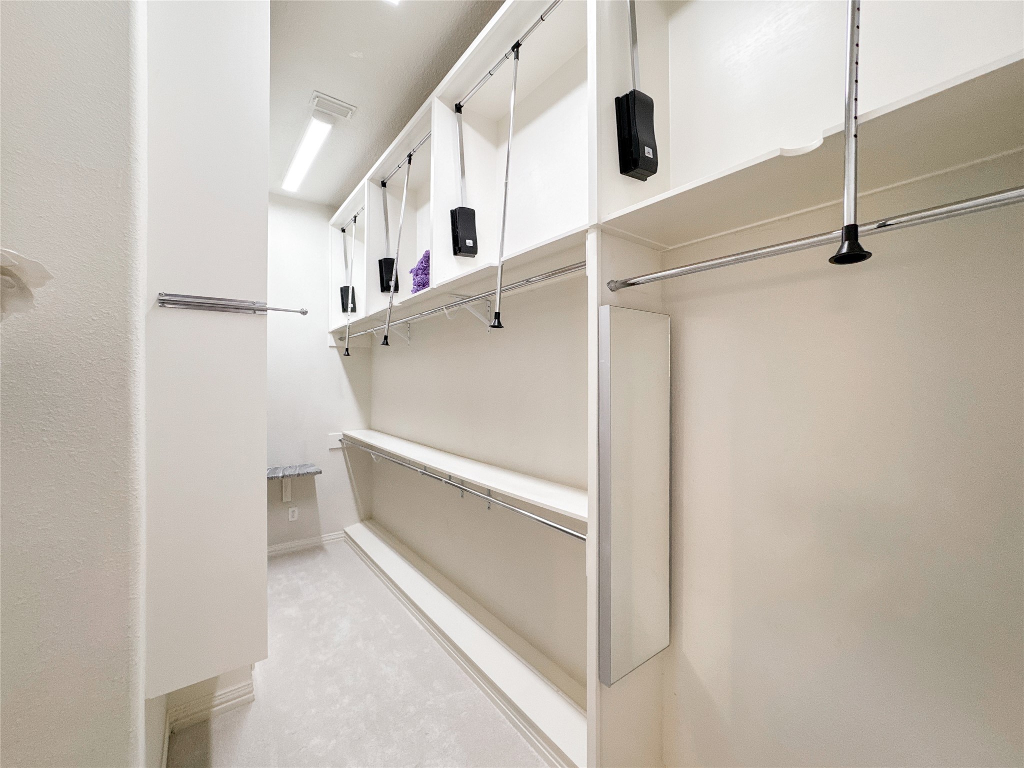 1810 Woerner Road Houston, TX 77090 - Photo 21 of 39 Spacious and well-lit primary closet, offering abundant storage and organization options for your wardrobe essentials.