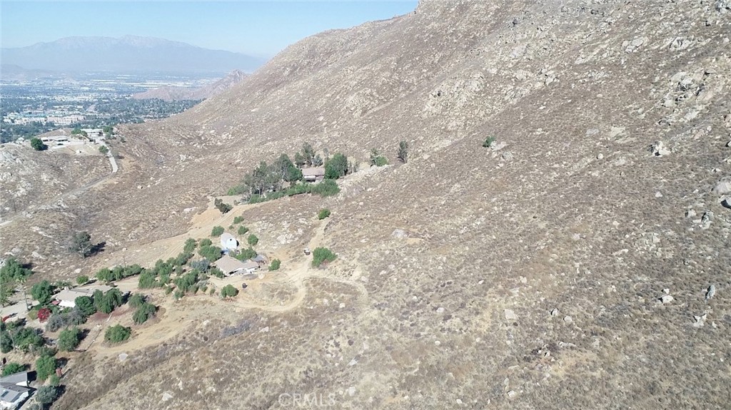 0 Pettegrew Road Riverside, CA 92507 - Photo 6 of 10 a view of a dry field with trees in the background