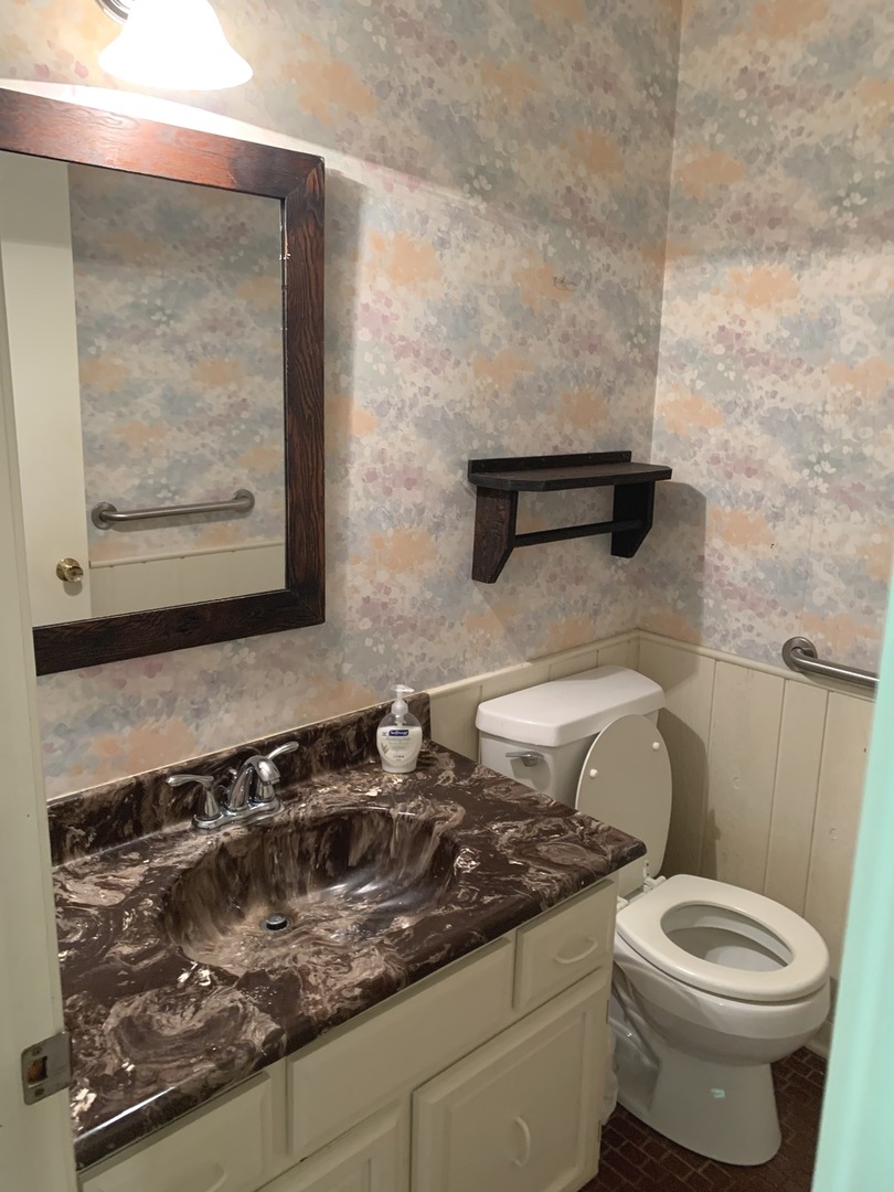 2210 Banbury Road Inverness, IL 60067 - Photo 11 of 41 a bathroom with a granite countertop toilet and a sink