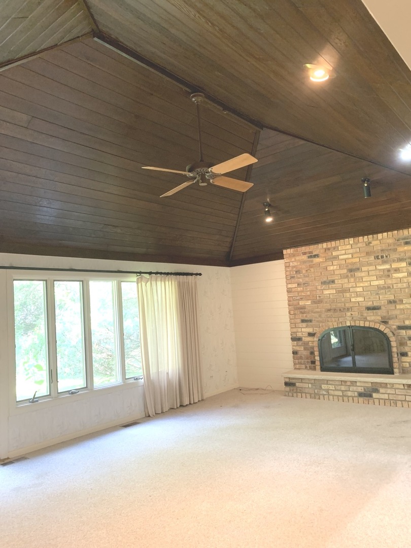 2210 Banbury Road Inverness, IL 60067 - Photo 15 of 41 a view of a livingroom with furniture and a window