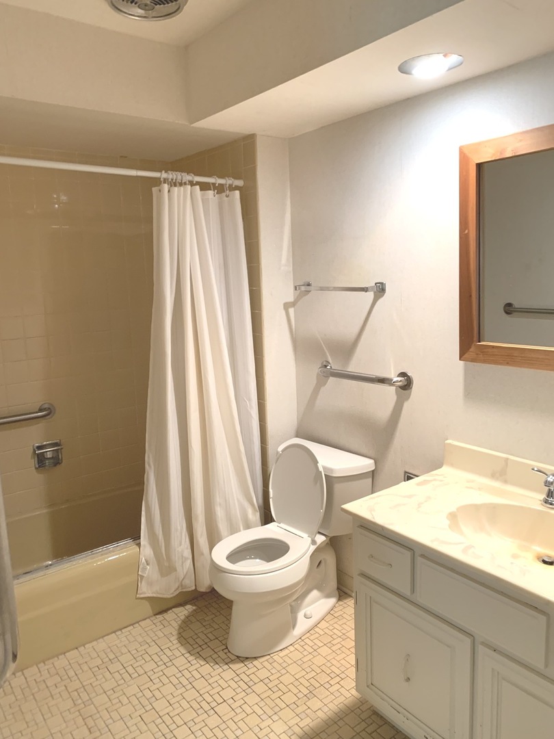 2210 Banbury Road Inverness, IL 60067 - Photo 22 of 41 a white toilet sitting next to a bathroom sink and a shower