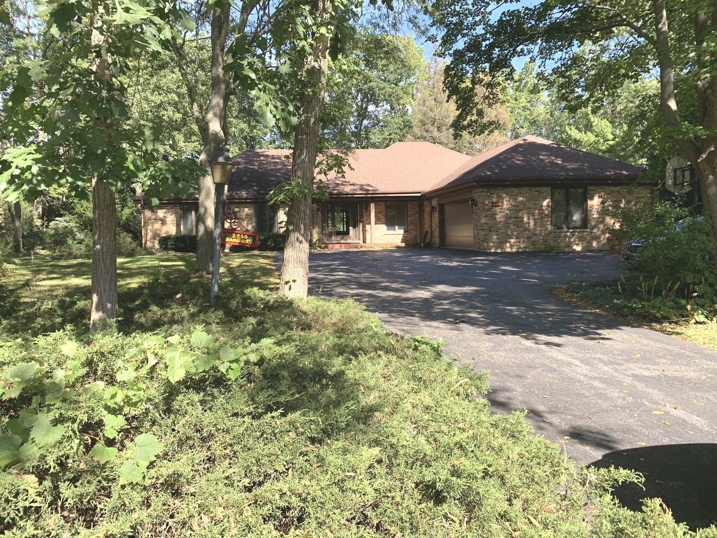 2210 Banbury Road Inverness, IL 60067 - Photo 41 of 41 a front view of a house with a yard and large trees