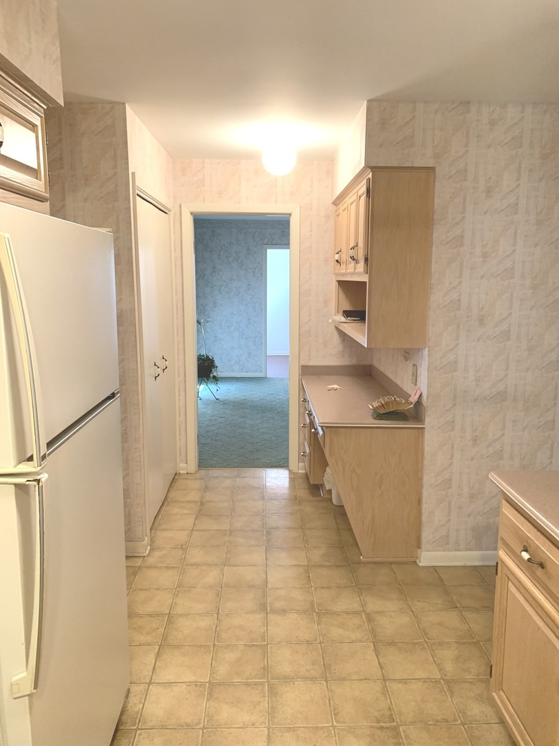 2210 Banbury Road Inverness, IL 60067 - Photo 9 of 41 a kitchen with stainless steel appliances granite countertop a refrigerator and a sink