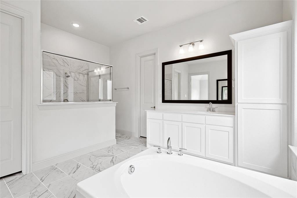 521 Carriage Hl Road Midlothian, TX 76065 - Photo 15 of 26 Bathroom featuring vanity, a marble finish shower, light marble finish flooring, and a bath