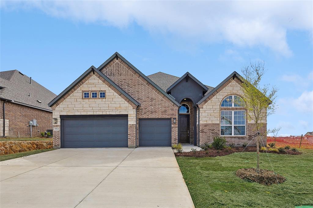 521 Carriage Hl Road Midlothian, TX 76065 - Photo 2 of 26 French country home with driveway, a garage, a front yard, and stone siding