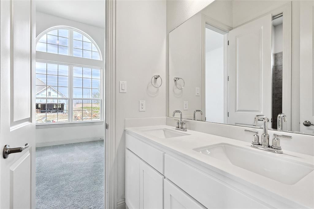 521 Carriage Hl Road Midlothian, TX 76065 - Photo 22 of 26 Full bath featuring double vanity and light colored carpet