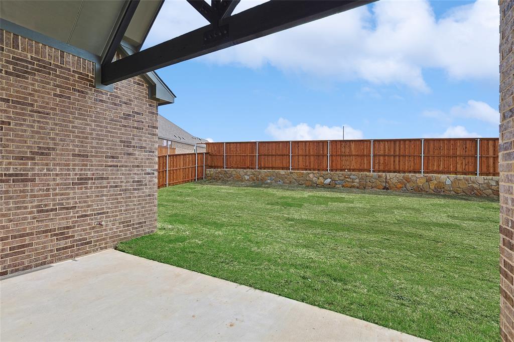 521 Carriage Hl Road Midlothian, TX 76065 - Photo 25 of 26 Fenced backyard featuring a patio area