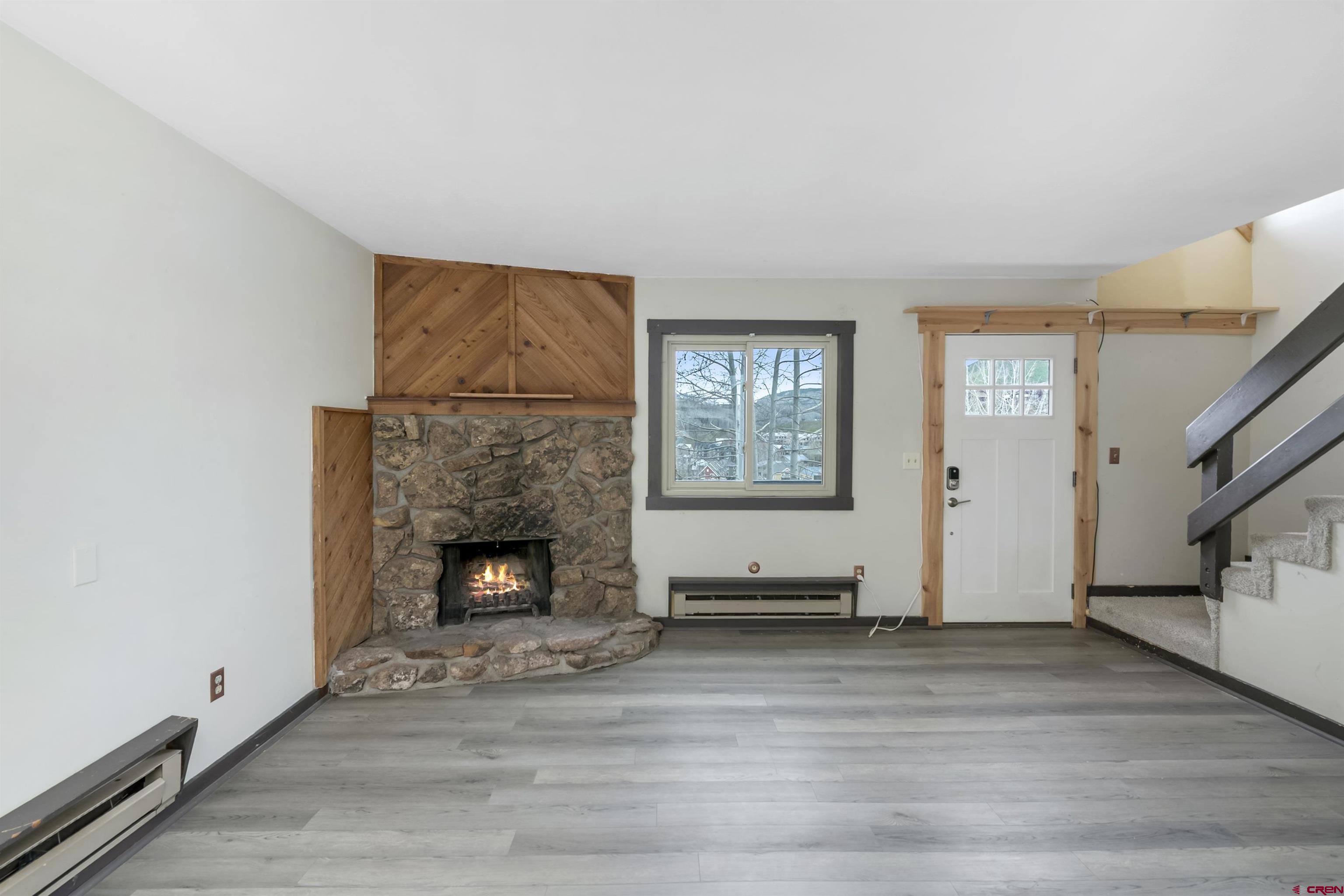 22 Castle Road, Unit 2 Crested Butte, CO 81225 - Photo 13 of 38 a living room with furniture and a fireplace