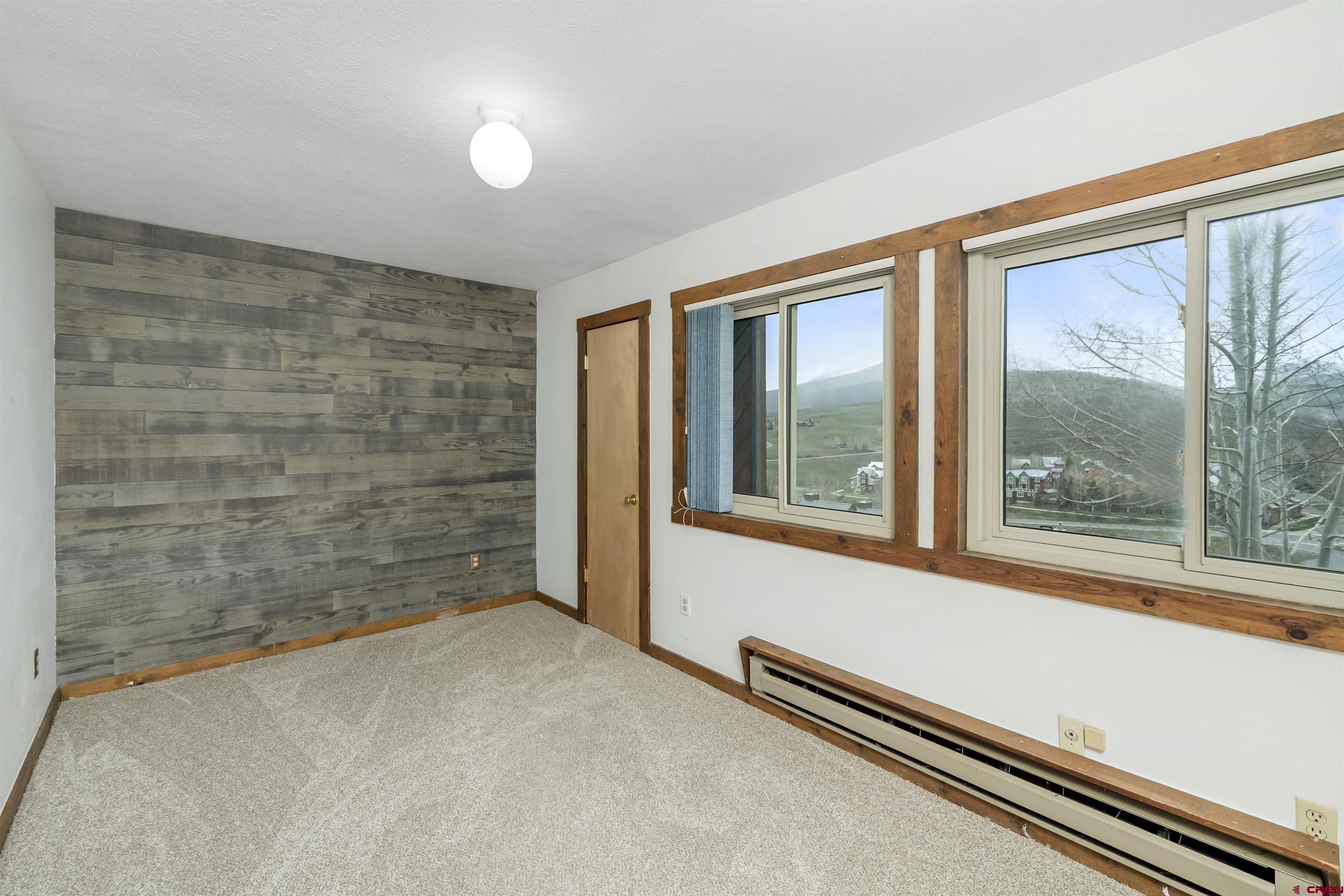 22 Castle Road, Unit 2 Crested Butte, CO 81225 - Photo 19 of 38 an empty room with windows