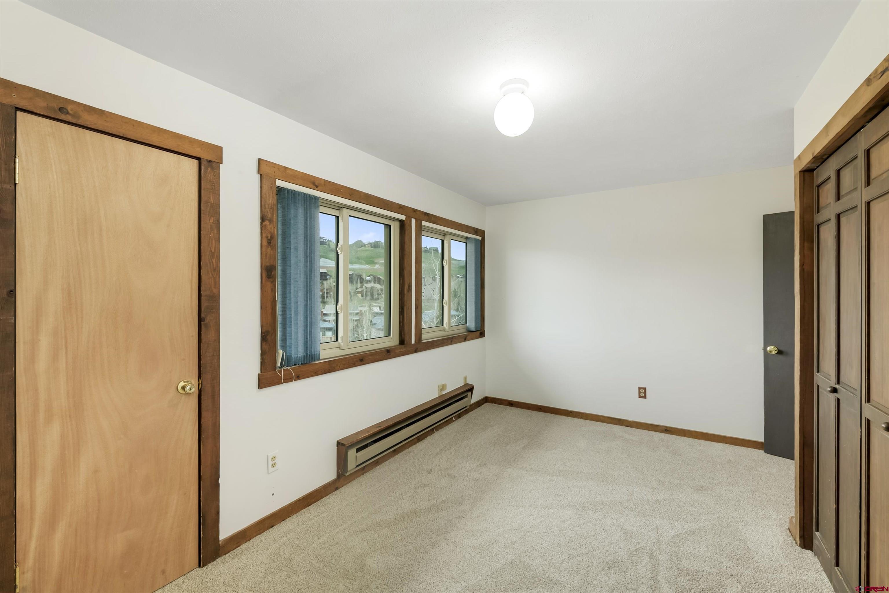 22 Castle Road, Unit 2 Crested Butte, CO 81225 - Photo 21 of 38 an empty room with windows