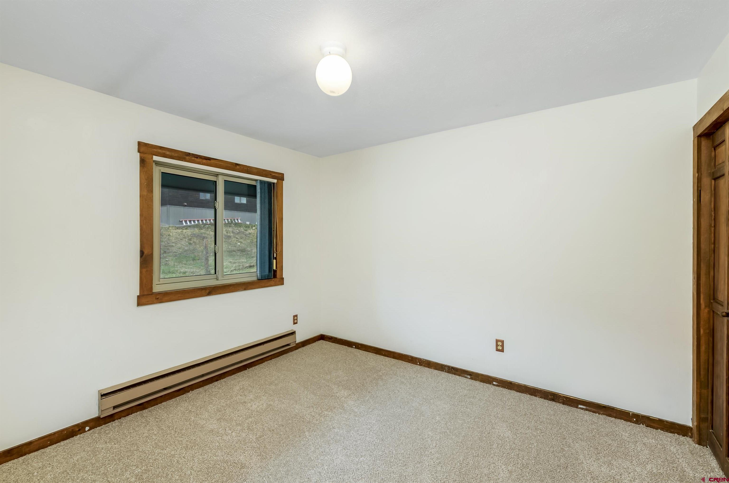 22 Castle Road, Unit 2 Crested Butte, CO 81225 - Photo 25 of 34 an empty room with a window
