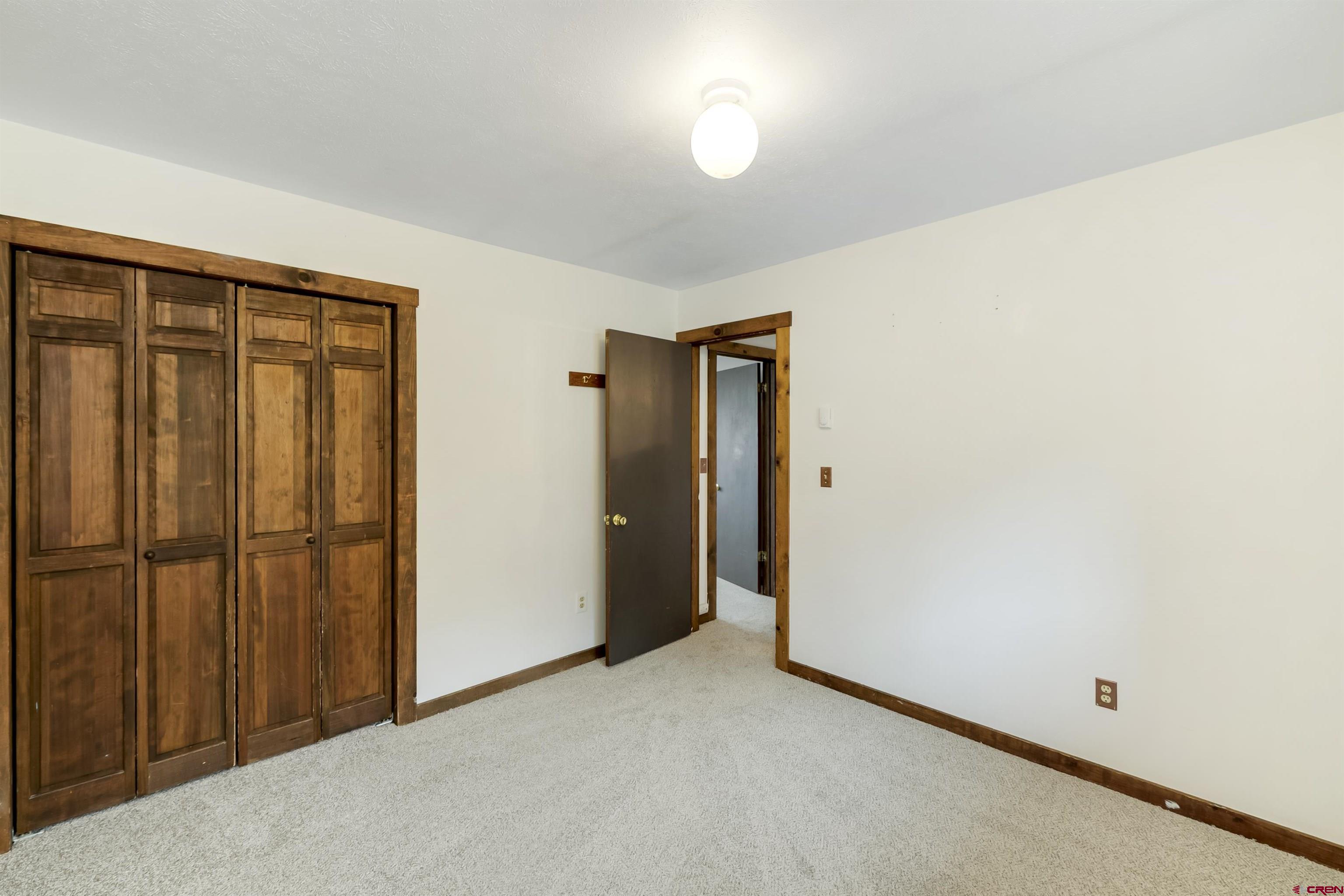 22 Castle Road, Unit 2 Crested Butte, CO 81225 - Photo 27 of 34 an empty room with a door